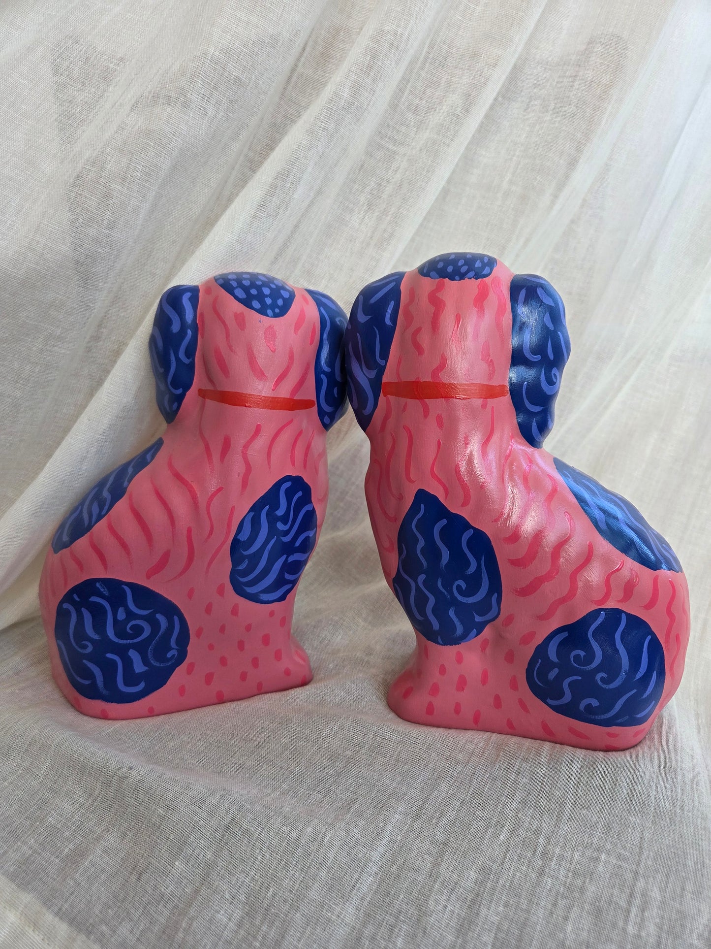 Medium Hand Painted Pair of Pink and Blue Mantle Dogs